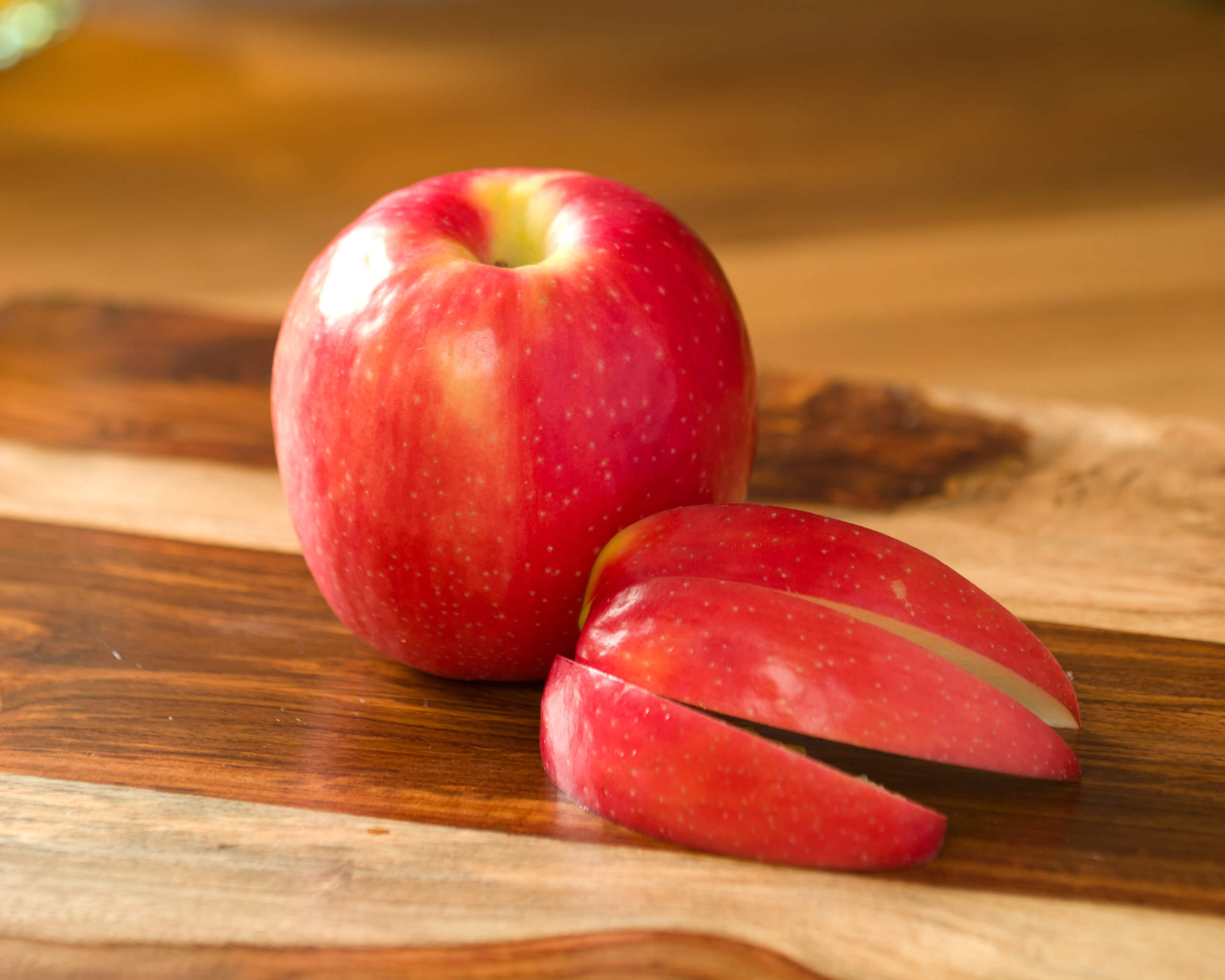 Pink Lady apples with slices.