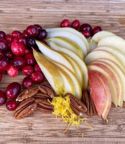 Pears, apples, and cranberries shown as ingredients.