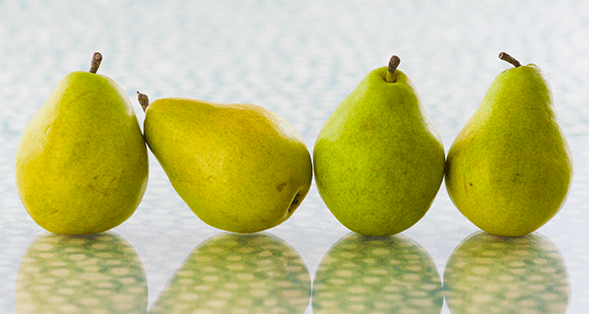 Four green pears. To upgrade your brunch mimosa, try swapping orange juice for pear juice.