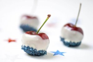 Cherry bites dipped in white chocolate with blue sprinkles