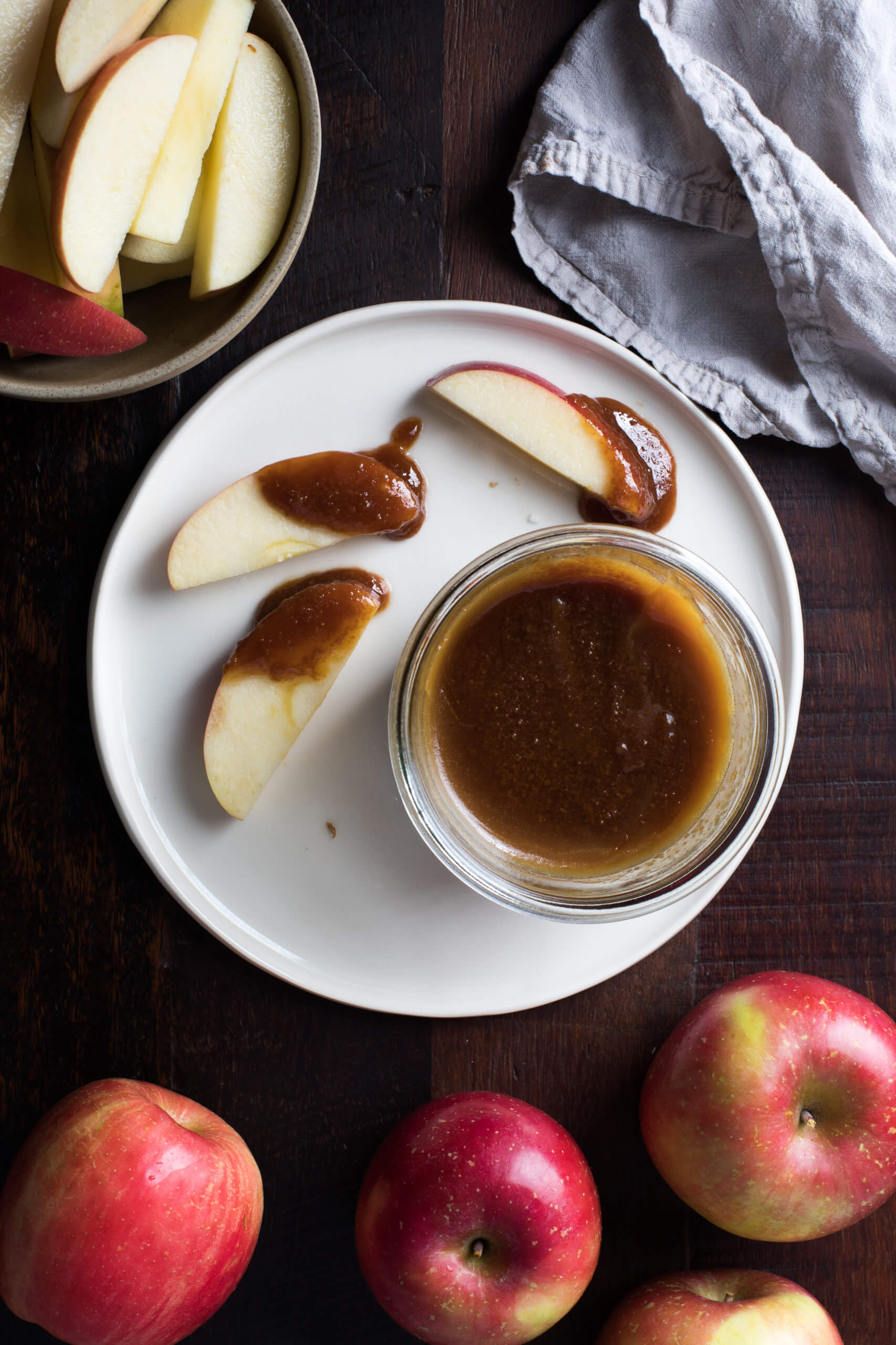 Caramel sauce on a plate for apple slices to be dipped in.