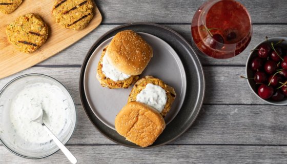 chickpea burger with yogurt sauce next to the plate