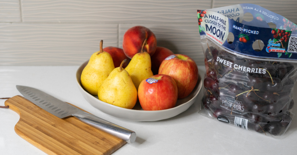 Apples, pears, cherries on counter