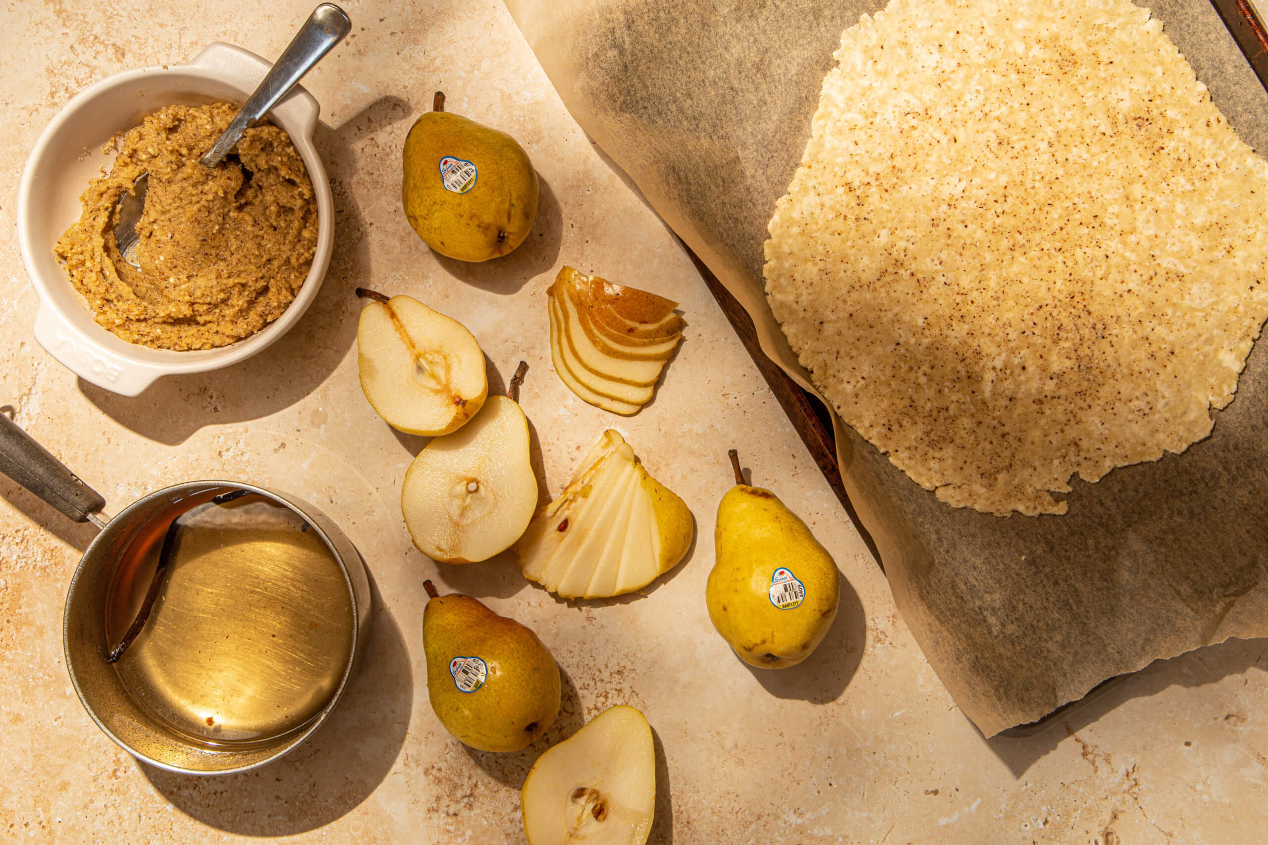 Sliced pears and other galette ingredients prior to building
