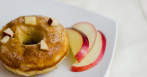 Baked Apple Donuts with apples slices on a plate