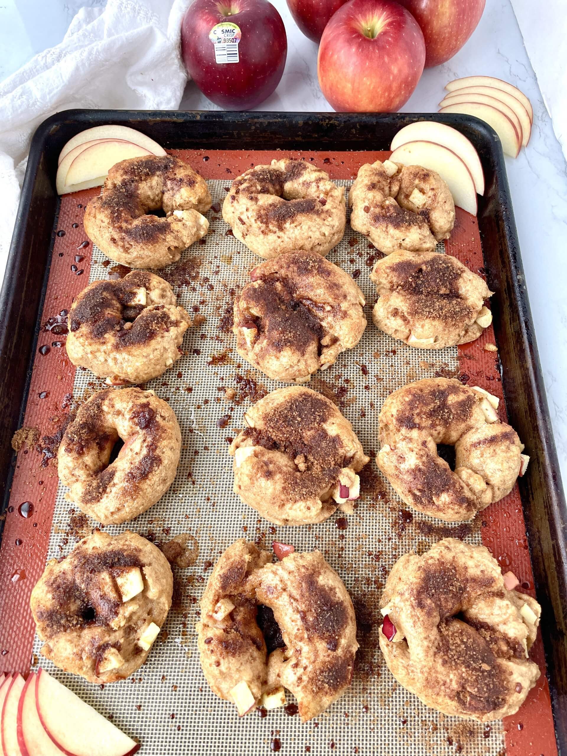 Apple Crunch bagels on a tray ready to bake