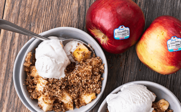 Raw apple crumble served with ice cream