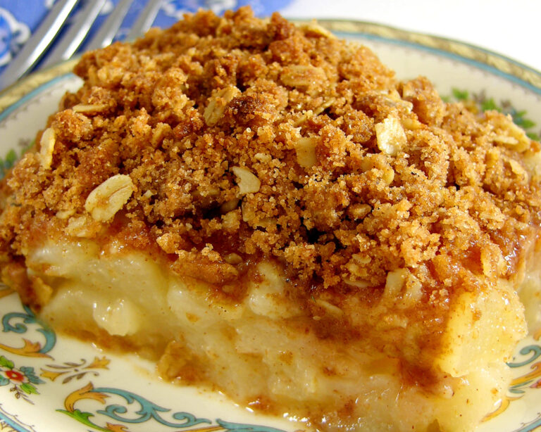 Classic Pear Crisp with a golden crumb topping on a decorative plate.