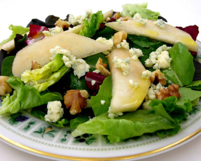 Fresh mixed greens salad with pears, walnuts, and blue cheese crumbles.