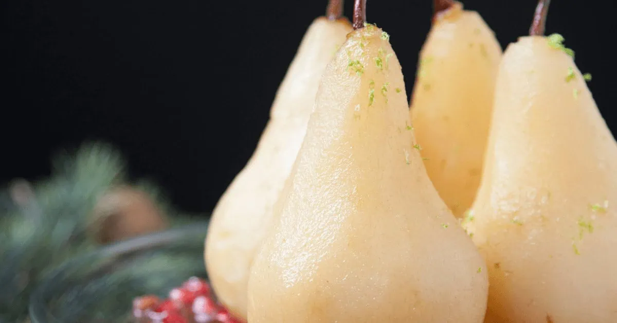 Fresh pears poached with spices and cranberries for a festive dessert.