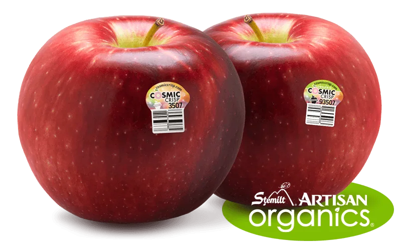 Two Cosmic Crisp apples with organic and artisan labels on a white background.