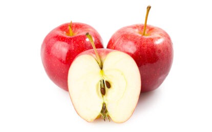 Fresh red Gala apples, one sliced in half showing interior and seeds.